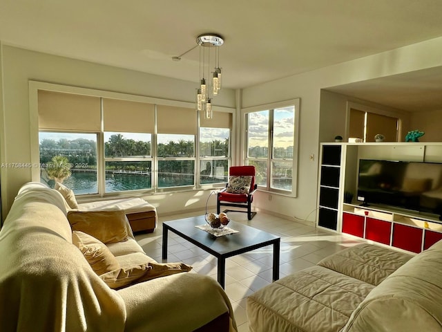 living area featuring tile patterned flooring and baseboards