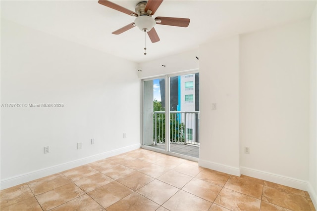 unfurnished room with a ceiling fan, baseboards, and light tile patterned floors