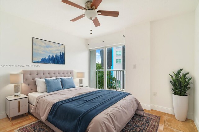 bedroom featuring a ceiling fan, baseboards, and access to outside