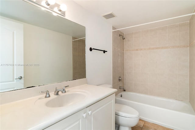 full bath with shower / bath combination, visible vents, toilet, vanity, and tile patterned floors