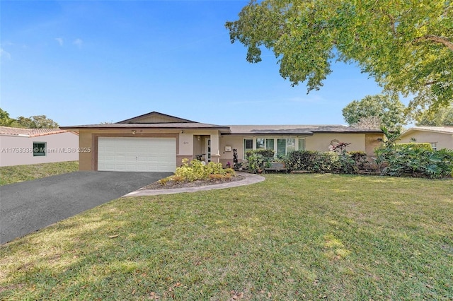 ranch-style house with aphalt driveway, a garage, a front yard, and stucco siding