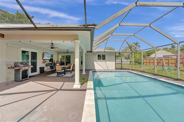 view of pool featuring a fenced in pool, area for grilling, a patio area, ceiling fan, and fence