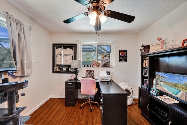 office area featuring ceiling fan, a textured ceiling, baseboards, and wood finished floors