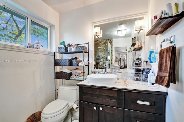 bathroom with vanity and toilet