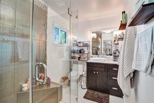 bathroom with a stall shower, tile patterned flooring, vanity, and toilet