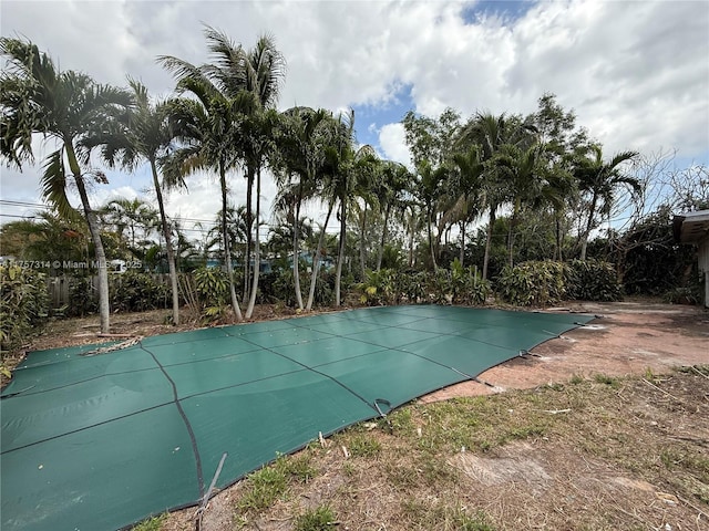 view of swimming pool with a covered pool