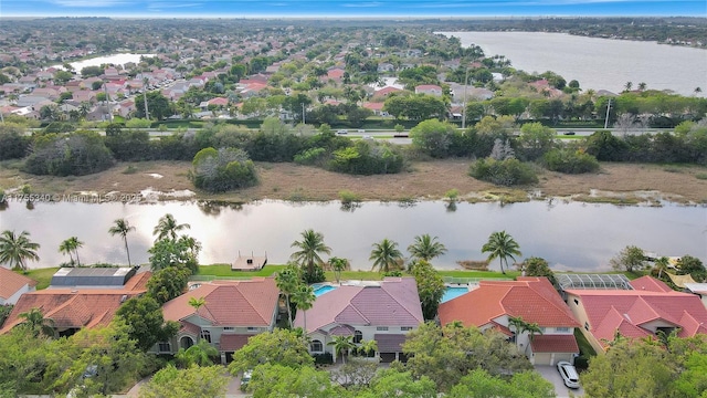 drone / aerial view featuring a water view and a residential view