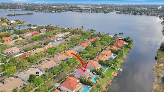 birds eye view of property featuring a residential view and a water view