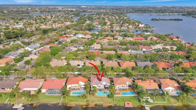 aerial view with a residential view and a water view