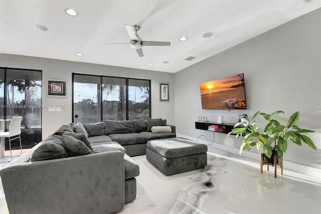 living room with baseboards, visible vents, a ceiling fan, and recessed lighting