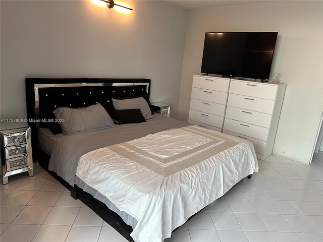 bedroom with light tile patterned flooring