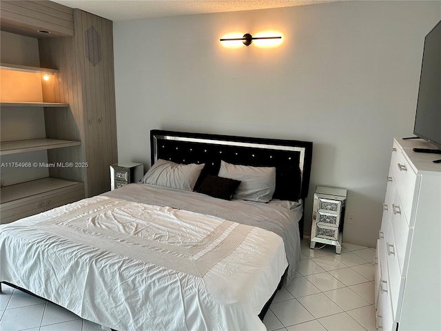 bedroom with light tile patterned flooring