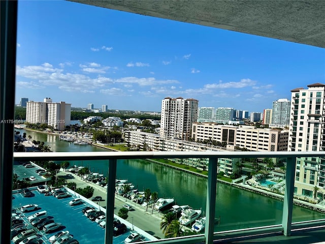 balcony featuring a water view and a view of city