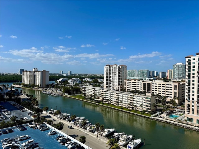 birds eye view of property featuring a water view and a city view