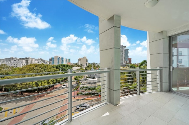 balcony featuring a city view