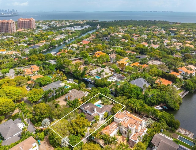 birds eye view of property with a residential view and a water view