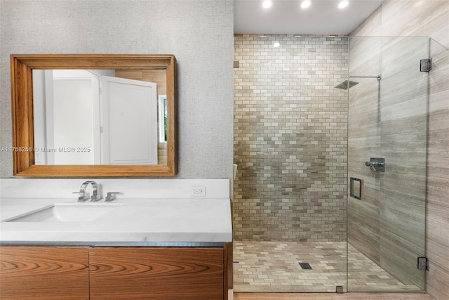 full bath featuring a shower stall and vanity