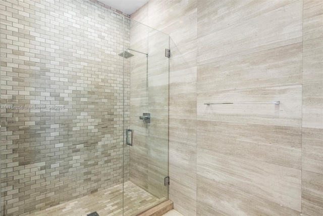 full bathroom featuring a shower stall