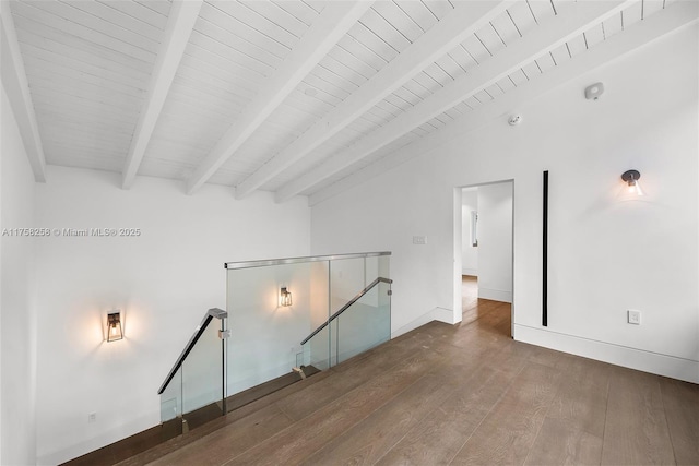 additional living space featuring lofted ceiling with beams, baseboards, wood ceiling, and wood finished floors