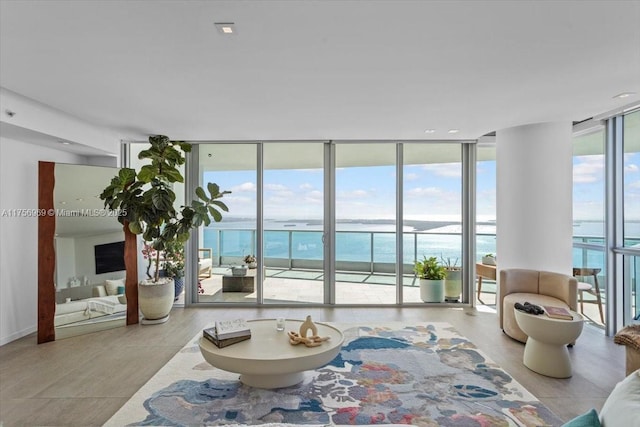 1331 Brickell Bay Dr Unit 4211, Miami, FL 33131 - living room featuring expansive windows, a water view, and wood finished floors