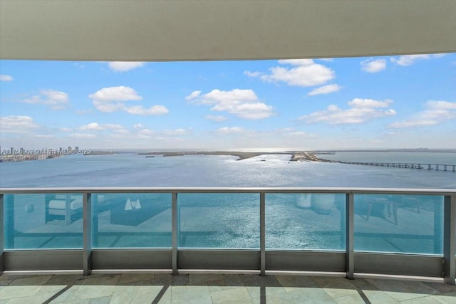 balcony featuring a water view