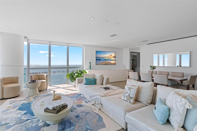 1331 Brickell Bay Dr Unit 4211, Miami, FL 33131 - living area featuring expansive windows, plenty of natural light, and a water view