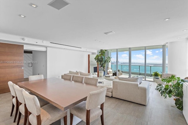 1331 Brickell Bay Dr Unit 4211, Miami, FL 33131 - dining space featuring floor to ceiling windows, a water view, and light wood-style flooring