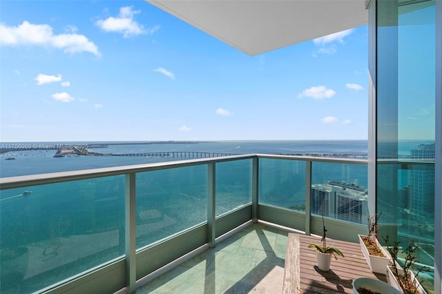 balcony featuring a water view