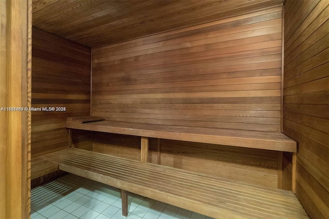 1331 Brickell Bay Dr Unit 4211, Miami, FL 33131 - sauna featuring tile patterned flooring, wood walls, and wooden ceiling