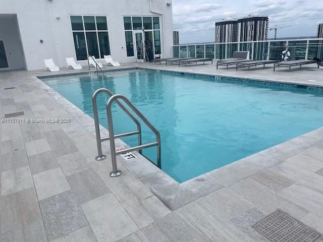 community pool with a patio