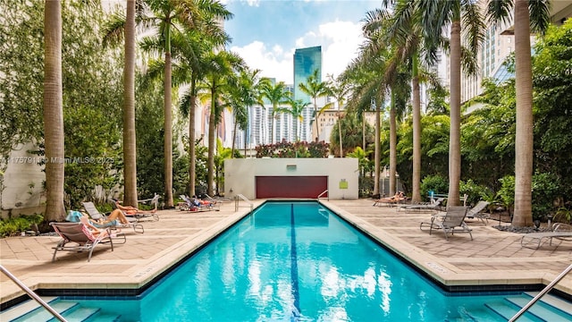 community pool with a patio