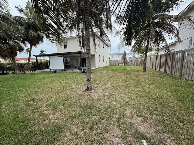 view of yard with a patio area and a fenced backyard