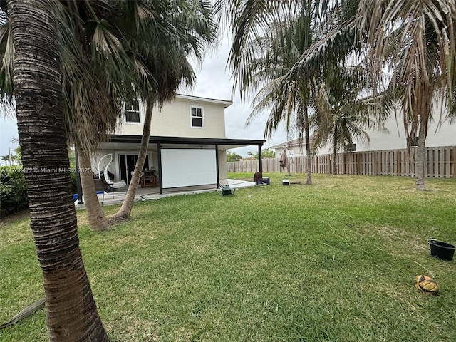 view of yard with a patio area and a fenced backyard