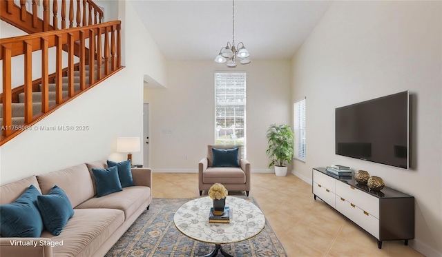 living area featuring baseboards, stairs, light tile patterned floors, an inviting chandelier, and high vaulted ceiling