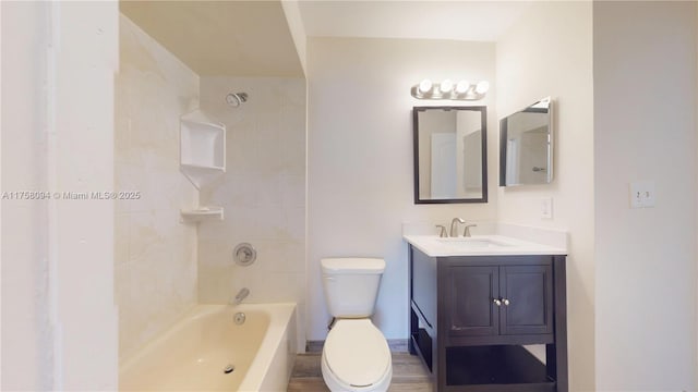 bathroom featuring shower / bathtub combination, toilet, and vanity