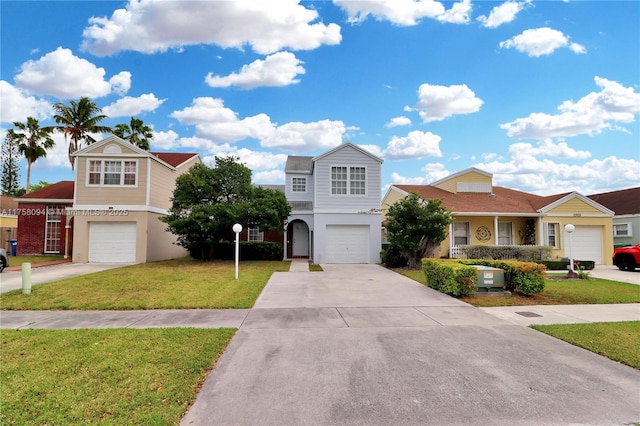 view of front of home featuring a front lawn, a garage, and driveway