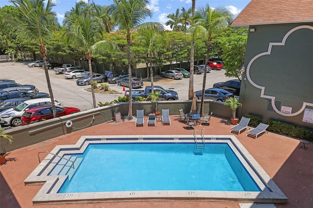 pool with a patio area