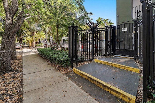 view of gate with fence