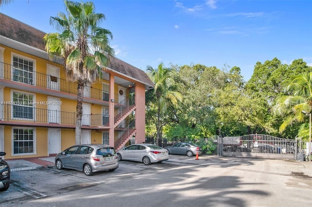 view of property featuring uncovered parking