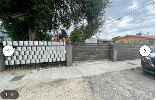 view of gate featuring fence