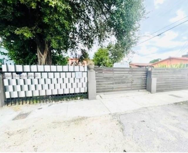 view of gate featuring fence