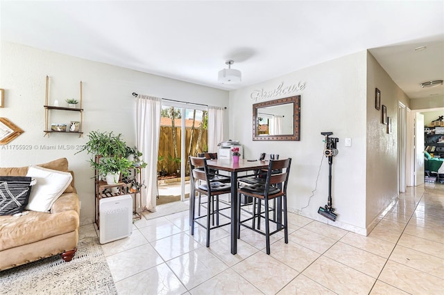 dining room with light tile patterned floors