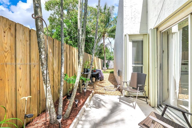 view of patio / terrace featuring fence