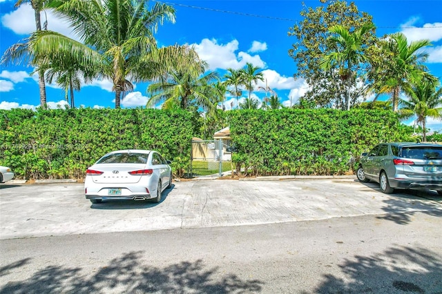 uncovered parking lot with fence