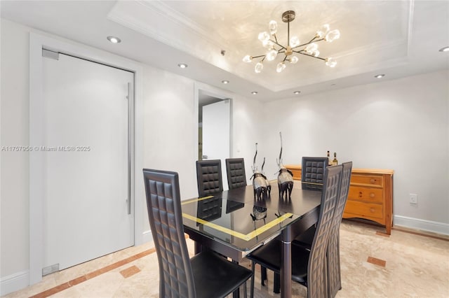 dining room featuring a tray ceiling, crown molding, a notable chandelier, recessed lighting, and baseboards