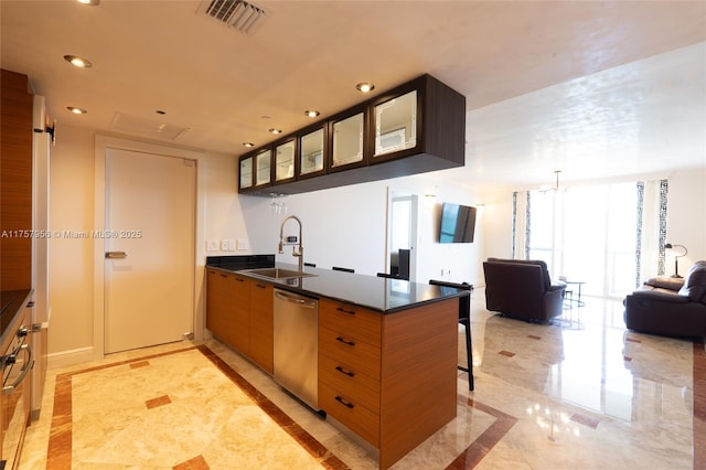 kitchen with recessed lighting, a peninsula, a sink, visible vents, and stainless steel dishwasher