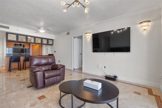 living area with marble finish floor, ornamental molding, visible vents, and baseboards