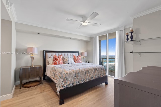 bedroom with light wood-style floors, access to outside, expansive windows, and ornamental molding