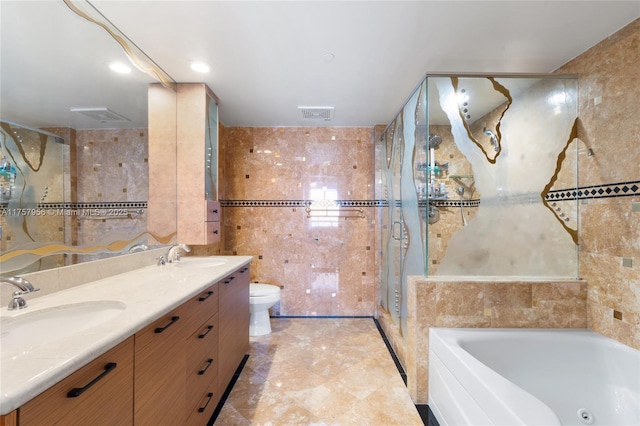 full bath featuring a sink, a garden tub, visible vents, and tile walls