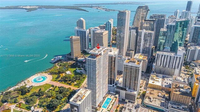 birds eye view of property featuring a water view and a view of city